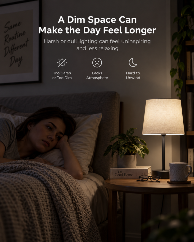 Woman lying in bed beside a dim bedside lamp in a softly lit room, illustrating a space that feels dull and less inviting.